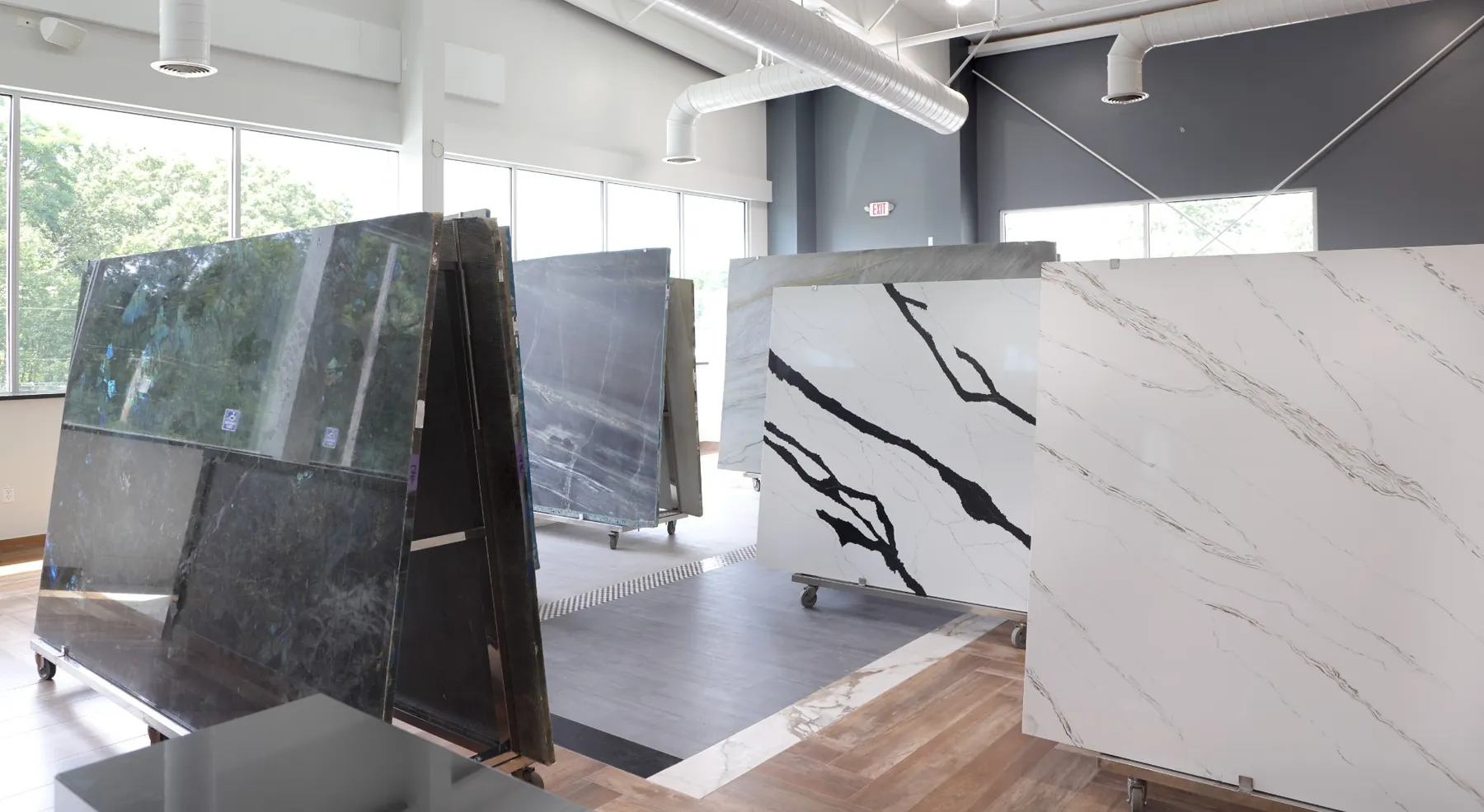 Rows of natural stone slabs at Caruso Stone Supply